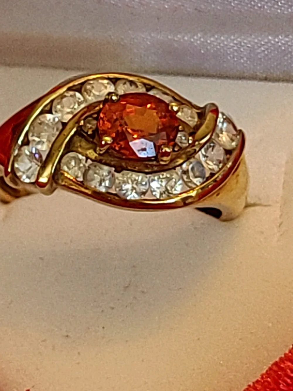 1.25ct. Spessartite Garnet Surrounded By 14 Sparkling Diamonds!